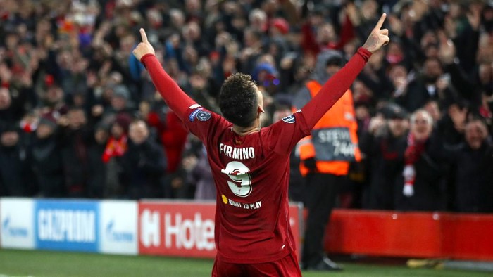 LIVERPOOL, ENGLAND - MARCH 11: Roberto Firmino of Liverpool celebrates after scoring his teams second goal during the UEFA Champions League round of 16 second leg match between Liverpool FC and Atletico Madrid at Anfield on March 11, 2020 in Liverpool, United Kingdom.  (Photo by Julian Finney/Getty Images)