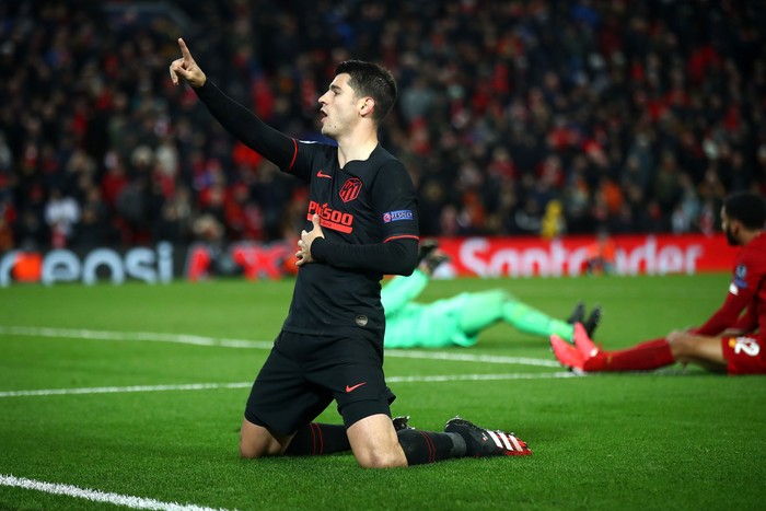 LIVERPOOL, ENGLAND - MARCH 11: Alvaro Morata of Atletico Madrid celebrates after scoring his teams third goal during the UEFA Champions League round of 16 second leg match between Liverpool FC and Atletico Madrid at Anfield on March 11, 2020 in Liverpool, United Kingdom.  (Photo by Julian Finney/Getty Images)