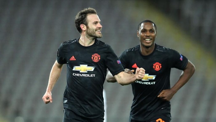 LINZ, AUSTRIA - MARCH 12: (FREE FOR EDITORIAL USE) In this handout image provided by UEFA, Juan Mata of Manchester United celebrates with Odion Ighalo after scoring his teams third goal during the UEFA Europa League round of 16 first leg match between LASK and Manchester United at Linzer Stadion on March 12, 2020 in Linz, Austria. The match is played behind closed doors as a precaution against the spread of COVID-19 (Coronavirus).  (Photo by UEFA - Handout/UEFA via Getty Images )
