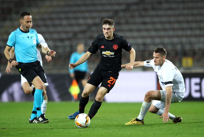 LINZ, AUSTRIA - MARCH 12: (FREE FOR EDITORIAL USE) In this handout image provided by UEFA, Daniel James of Manchester United is challenged by Christian Ramsebner of LASK during the UEFA Europa League round of 16 first leg match between LASK and Manchester United at Linzer Stadion on March 12, 2020 in Linz, Austria. The match is played behind closed doors as a precaution against the spread of COVID-19 (Coronavirus).  (Photo by UEFA - Handout/UEFA via Getty Images )
