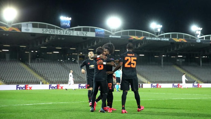 LINZ, AUSTRIA - MARCH 12: (FREE FOR EDITORIAL USE) In this handout image provided by UEFA, Juan Mata of Manchester United celebrates with his team mates after scoring his teams third goal  during the UEFA Europa League round of 16 first leg match between LASK and Manchester United at Linzer Stadion on March 12, 2020 in Linz, Austria. The match is played behind closed doors as a precaution against the spread of COVID-19 (Coronavirus).  (Photo by UEFA - Handout/UEFA via Getty Images )