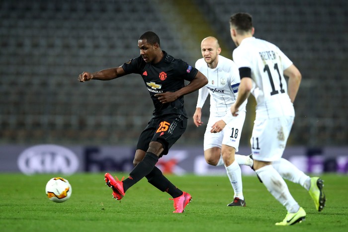 LINZ, AUSTRIA - MARCH 12: (FREE FOR EDITORIAL USE) In this handout image provided by UEFA, Odion Ighalo of Manchester United is challenged by Gernot Trauner and Dominik Reiter of LASK during the UEFA Europa League round of 16 first leg match between LASK and Manchester United at Linzer Stadion on March 12, 2020 in Linz, Austria. The match is played behind closed doors as a precaution against the spread of COVID-19 (Coronavirus).  (Photo by UEFA - Handout/UEFA via Getty Images )