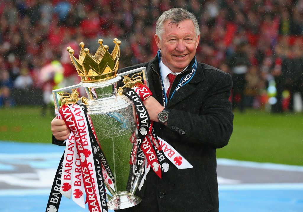 MANCHESTER, ENGLAND - MAY 12:  Manchester United Manager Sir Alex Ferguson celebrates with the Premier League trophy following the Barclays Premier League match between Manchester United and Swansea City at Old Trafford on May 12, 2013 in Manchester, England.  (Photo by Alex Livesey/Getty Images)