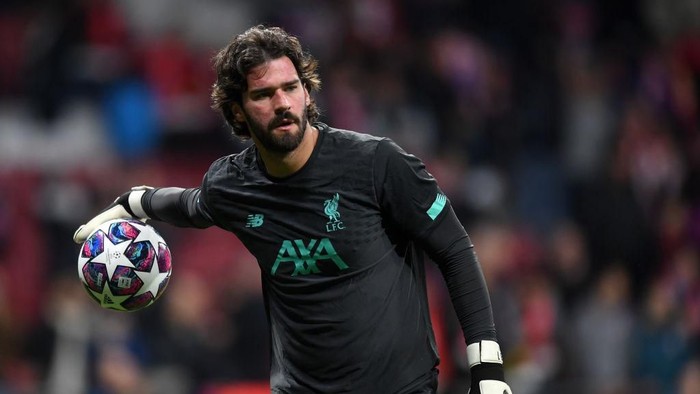 MADRID, SPAIN - FEBRUARY 18: Alisson Becker of Liverpool warms up prior to the UEFA Champions League round of 16 first leg match between Atletico Madrid and Liverpool FC at Wanda Metropolitano on February 18, 2020 in Madrid, Spain. (Photo by Michael Regan/Getty Images)