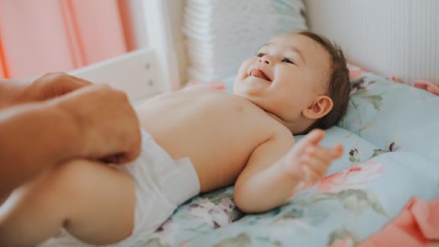 Father changing diaper
