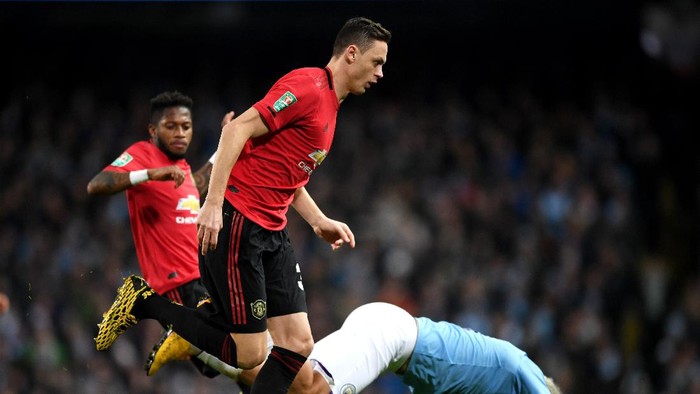 MANCHESTER, ENGLAND - JANUARY 29: Sergio Aguero of Manchester City is tackled by Nemanja Matic and Fred of Manchester United during the Carabao Cup Semi Final match between Manchester City and Manchester United at Etihad Stadium on January 29, 2020 in Manchester, England. (Photo by Shaun Botterill/Getty Images)