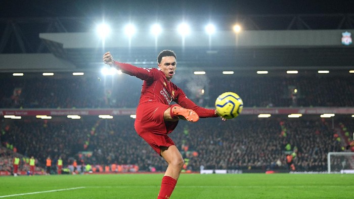 LIVERPOOL, ENGLAND - JANUARY 19: Trent Alexander-Arnold of Liverpool crosses the ball during the Premier League match between Liverpool FC and Manchester United at Anfield on January 19, 2020 in Liverpool, United Kingdom. (Photo by Michael Regan/Getty Images)