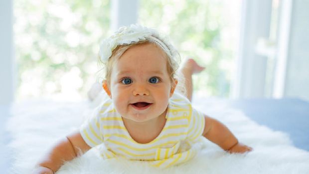 Happy baby girl. Happy little princess.
