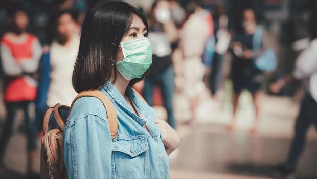 Ilustrasi orang mengenakan masker saat pandemi Corona