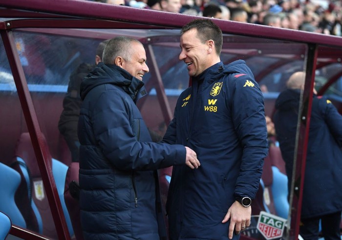 BIRMINGHAM, ENGLAND - FEBRUARY 16: Jose Mourinho, Manager of Tottenham Hotspur shares a joke with Aston Villa assistant Manager John Terry during the Premier League match between Aston Villa and Tottenham Hotspur at Villa Park on February 16, 2020 in Birmingham, United Kingdom. (Photo by Laurence Griffiths/Getty Images)