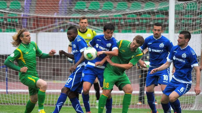 GRODNO,BELARUS - JUNE 15: Pavel Rybak of FC Neman Grodno (#18) vies for the ball during the Belarusian Premier League match between FC Neman Grodno and FC Dinamo Minsk at the Neman Stadium on June 15,2014 in Grodno,Belarus. (Photo by Viktor Drachev/EuroFootball/Getty Images)