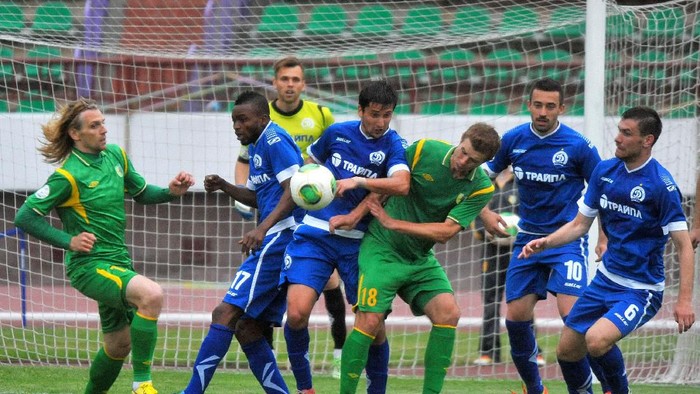 GRODNO,BELARUS - JUNE 15:   Pavel Rybak of FC Neman Grodno (#18)  vies for the ball during the Belarusian Premier League match between FC Neman Grodno and FC Dinamo Minsk at the Neman Stadium on June 15,2014 in Grodno,Belarus. (Photo by Viktor Drachev/EuroFootball/Getty Images)