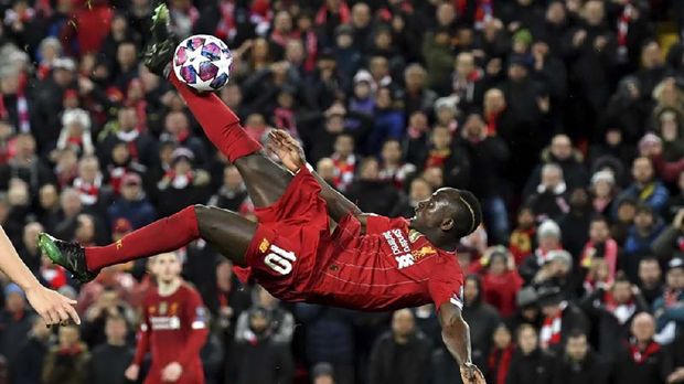 Liverpool's Senegalese striker Sadio Mane's bicycle kick goes over the bar during the UEFA Champions league Round of 16 second leg football match between Liverpool and Atletico Madrid at Anfield in Liverpool, north west England on March 11, 2020. (Photo by Paul ELLIS / AFP)