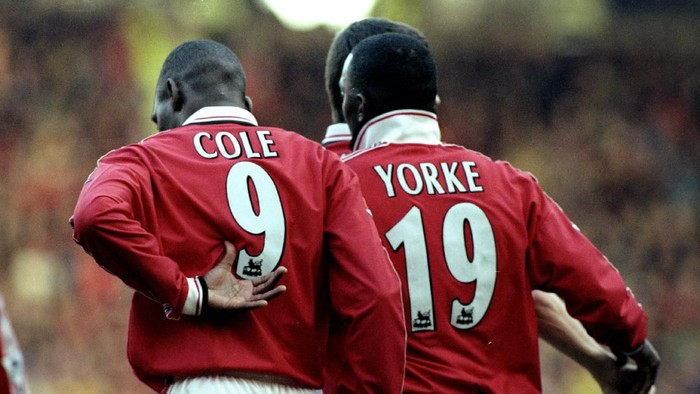 27 Feb 1999:  Dwight Yorke and Andy Cole of Manchester United celebrate a goal together during the FA Carling Premiership match against Southampton played at Old Trafford in Manchester, England.  The match finished in a 2-1 win for Manchester United.  Mandatory Credit: Laurence Griffiths /Allsport