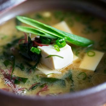 Fresh miso soup in bowl with tofu and mixed vegetables