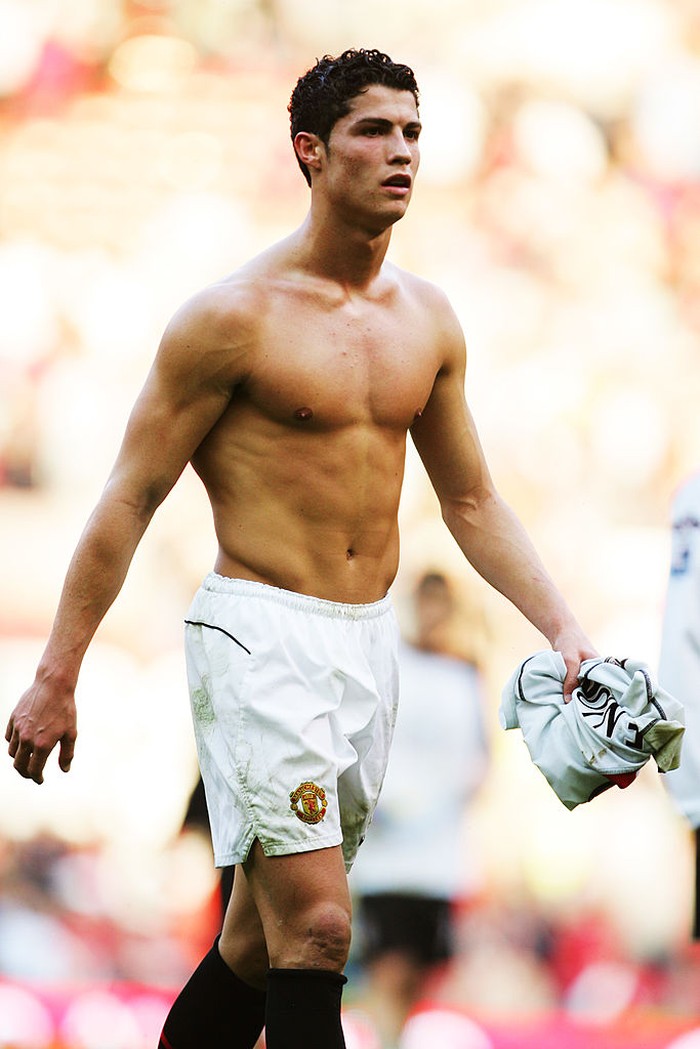 MANCHESTER, ENGLAND - MARCH 19:  Cristiano Ronaldo of Manchester United takes his shirt off following the FA Barclays Premiership match between Manchester United and Fulham at Old Trafford on March 19, 2005 in Manchester, England.  (Photo by Laurence Griffiths/Getty Images)