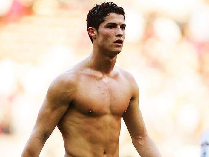 MANCHESTER, ENGLAND - MARCH 19:  Cristiano Ronaldo of Manchester United takes his shirt off following the FA Barclays Premiership match between Manchester United and Fulham at Old Trafford on March 19, 2005 in Manchester, England.  (Photo by Laurence Griffiths/Getty Images)