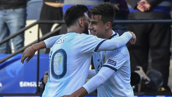 Argentinas Paulo Dybala (R) celebrates with teammate Lionel Messi after scoring against Chile during their Copa America football tournament third-place match at the Corinthians Arena in Sao Paulo, Brazil, on July 6, 2019. (Photo by Nelson ALMEIDA / AFP)