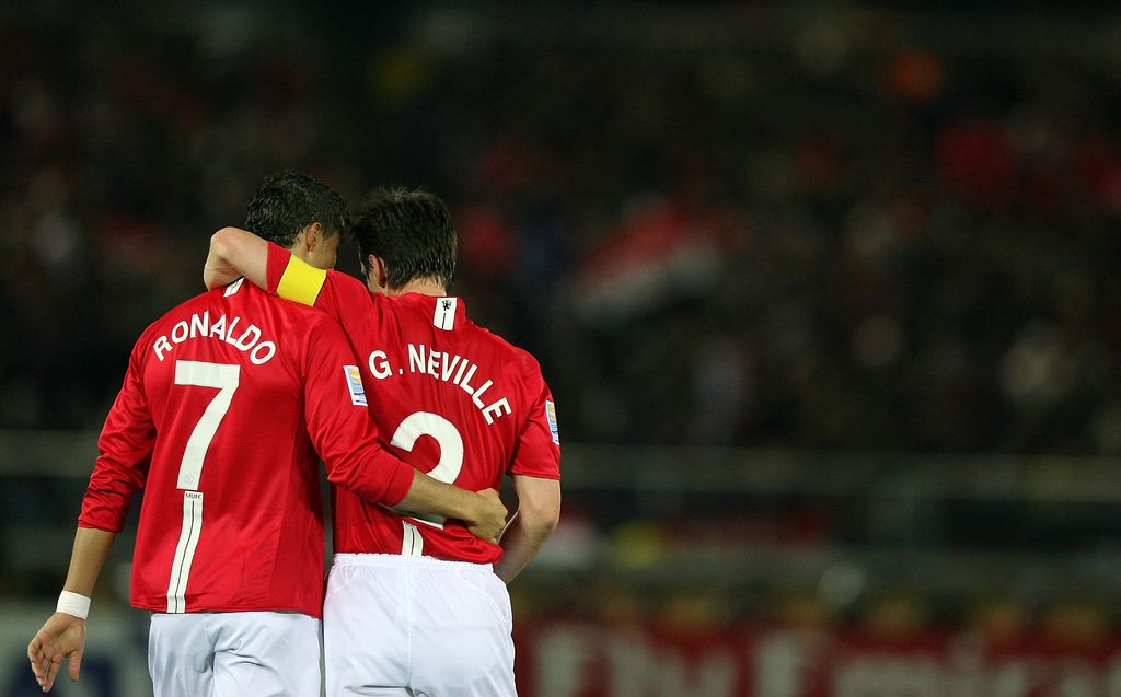 YOKOHAMA, JAPAN - DECEMBER 18:  Cristiano Ronaldo of Manchester United celebrates scoring the second goal with his teammate Gary nevilleduring the FIFA Club World Cup semi final match between Manchester United and Gamba Osaka at the International Stadium Yokohama on December 18, 2008 in Yokohama, Kanagawa, Japan.  (Photo by Kiyoshi Ota/Getty Images)