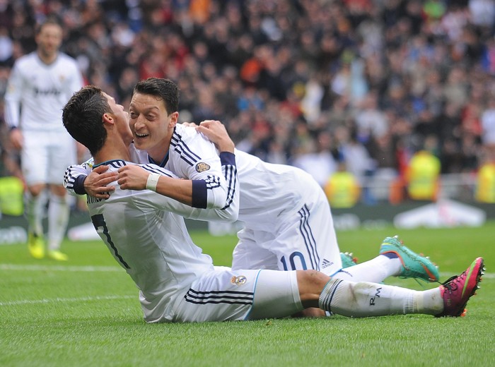 MADRID, SPAIN - JANUARY 27: Mesut Ozil (R) of Real Madrid CF celbrates with Cristiano Ronaldo after Ronaldo scored Reals 2nd goal during the La Liga match between Real Madrid CF and Getafe CF at estadio Santiago Bernabeu on January 27, 2013 in Madrid, Spain.  (Photo by Denis Doyle/Getty Images)