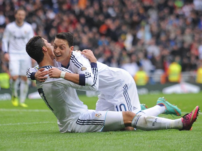 MADRID, SPAIN - JANUARY 27: Mesut Ozil (R) of Real Madrid CF celbrates with Cristiano Ronaldo after Ronaldo scored Real's 2nd goal during the La Liga match between Real Madrid CF and Getafe CF at estadio Santiago Bernabeu on January 27, 2013 in Madrid, Spain.  (Photo by Denis Doyle/Getty Images)