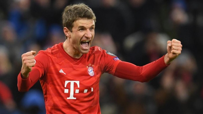 (FILES) In this file photo taken on December 11, 2019 Bayern Munichs German forward Thomas Mueller celebrates scoring during the UEFA Champions League Group B football match between Bayern Munich and Tottenham FC in Munich, Germany. - Thomas Mueller has signed a new deal that will keep the forward at Bayern Munich until 2023, the Bundesliga champions announced on April 7, 2020. (Photo by Christof STACHE / AFP)