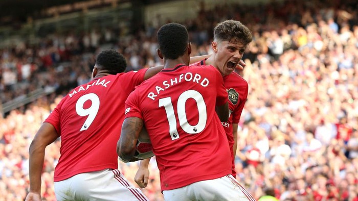 MANCHESTER, ENGLAND - AUGUST 24: Daniel James of Manchester United celebrates scoring his teams first goal with Anthony Martial and Marcus Rashford during the Premier League match between Manchester United and Crystal Palace at Old Trafford on August 24, 2019 in Manchester, United Kingdom. (Photo by Jan Kruger/Getty Images)
