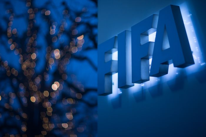 FIFA ZURICH, SWITZERLAND - DECEMBER 03: An illuminated FIFA logo sits on a sign at the FIFA headquarters on December 3, 2015 in Zurich, Switzerland. (Photo by Philipp Schmidli/Getty Images)