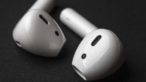 White wireless bluetooth earphones or headphones, macro photo close up