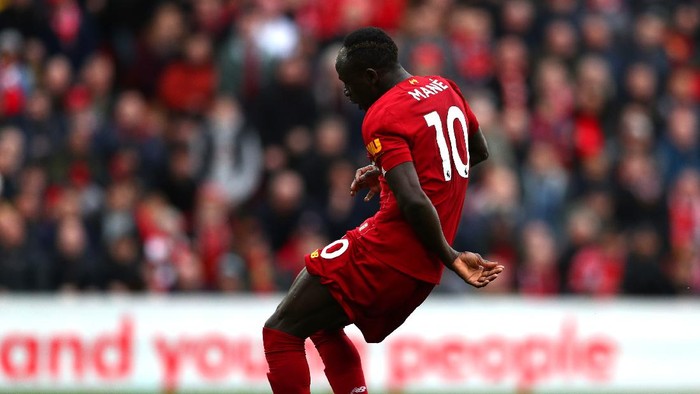 LIVERPOOL, ENGLAND - MARCH 07: Sadio Mane of Liverpool scores his teams second goal during the Premier League match between Liverpool FC and AFC Bournemouth  at Anfield on March 07, 2020 in Liverpool, United Kingdom. (Photo by Jan Kruger/Getty Images)