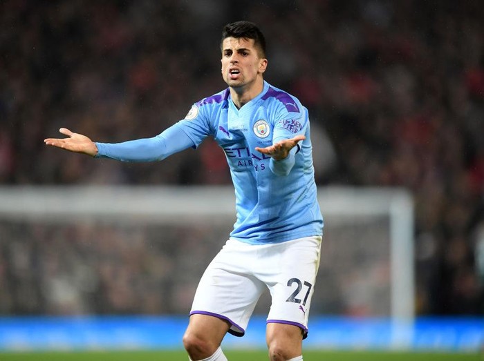 MANCHESTER, ENGLAND - MARCH 08: Joao Cancelo of Manchester City reacts during the Premier League match between Manchester United and Manchester City at Old Trafford on March 08, 2020 in Manchester, United Kingdom. (Photo by Michael Regan/Getty Images)