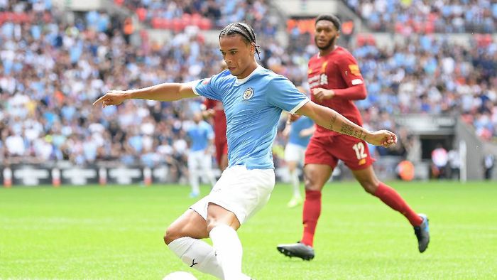 Leroy Sane LONDON, ENGLAND - AUGUST 04: Leroy Sane of Manchester City shoots during the FA Community Shield match between Liverpool and Manchester City at Wembley Stadium on August 04, 2019 in London, England. (Photo by Michael Regan/Getty Images)