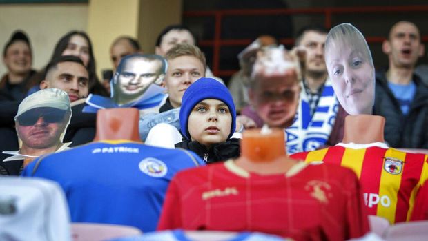 In this photo taken on Wednesday, April 8, 2020, fans sit in the stands among mannequins in soccer uniforms with the faces of 