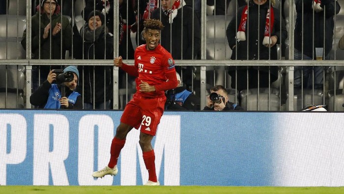 Bayern Munichs French forward Kingsley Coman celebrates after scoring the first goal during the UEFA Champions League Group B football match between Bayern Munich and Tottenham FC on December 11, 2019 in Munich, Germany. (Photo by Odd ANDERSEN / AFP)