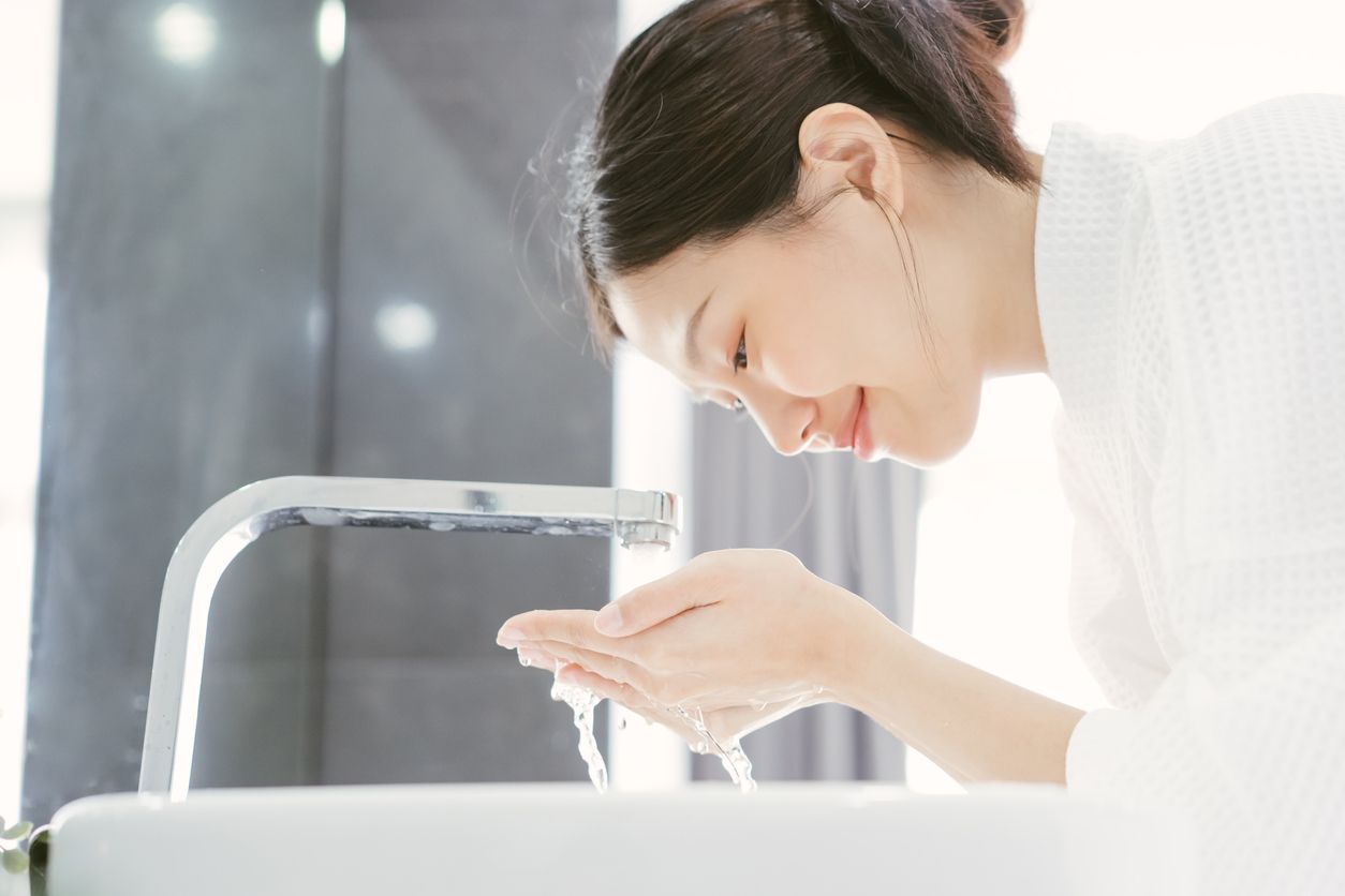Young Asian Woman Washing Her Face