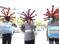 Banyuwangi Sosialisasi Bahaya COVID-19 Lewat Helm Corona dan Bagi Masker