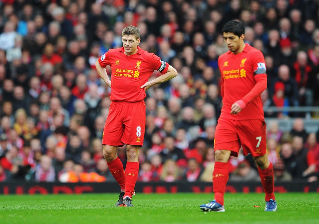 LIVERPOOL, ENGLAND - APRIL 21: Steven Gerrard (L) of Liverpool and team mate Luis Suarez look dejected after the opening goal by Oscar of Chelsea during the Barclays Premier League match between Liverpool and Chelsea at Anfield on April 21, 2013 in Liverpool, England.  (Photo by Michael Regan/Getty Images)