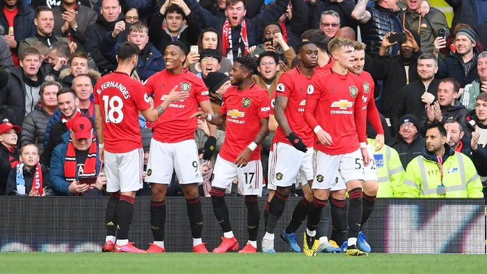 MANCHESTER, ENGLAND - MARCH 08: Anthony Martial of Manchester United celebrates with his team after scoring his sides first goal during the Premier League match between Manchester United and Manchester City at Old Trafford on March 08, 2020 in Manchester, United Kingdom. (Photo by Laurence Griffiths/Getty Images)