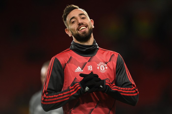 Manchester Uniteds Portuguese midfielder Bruno Fernandes warms up prior to the UEFA Europa League round of 32 second leg football match between Manchester United and Club Brugge at Old Trafford in Manchester, north west England, on February 27, 2020. (Photo by Oli SCARFF / AFP)