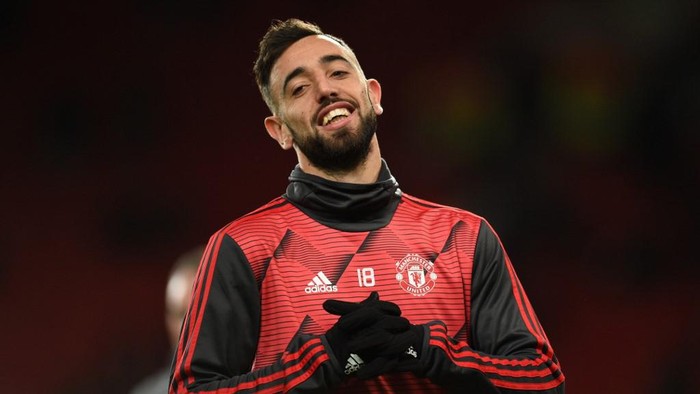 Manchester Uniteds Portuguese midfielder Bruno Fernandes warms up prior to the UEFA Europa League round of 32 second leg football match between Manchester United and Club Brugge at Old Trafford in Manchester, north west England, on February 27, 2020. (Photo by Oli SCARFF / AFP)