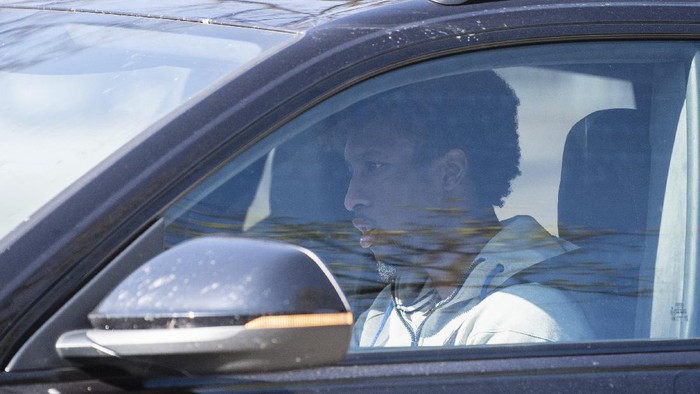 Soccer player Kingsley Coman drives his car into the underground car park at the FC Bayern training ground in Munich, Germany, Monday, April 6, 2020. The Bundesliga soccer team of FC Bayern Munich start with training in small groups. (Matthias Balk/dpa via AP)