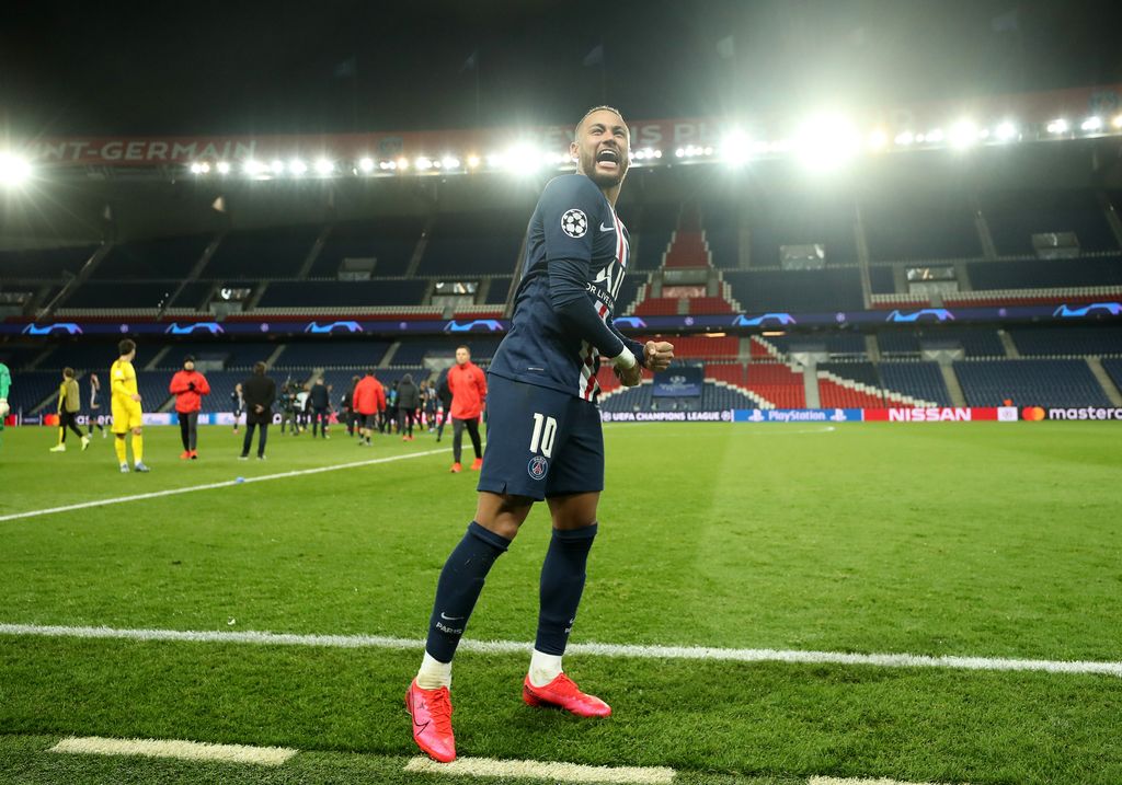 PARIS, FRANCE - MARCH 11: (FREE FOR EDITORIAL USE) In this handout image provided by UEFA, Neymar of Paris Saint-Germain celebrates victory after the UEFA Champions League round of 16 second leg match between Paris Saint-Germain and Borussia Dortmund at Parc des Princes on March 11, 2020 in Paris, France. The match is played behind closed doors as a precaution against the spread of COVID-19 (Coronavirus).  (Photo by UEFA - Handout/UEFA via Getty Images)