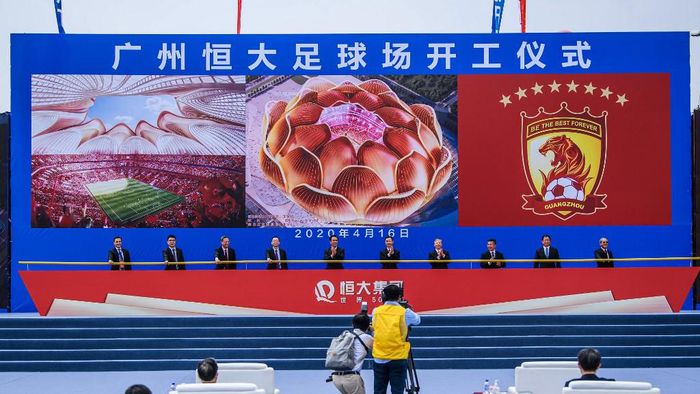 People attend the ground-breaking ceremony of Guangzhou Evergrandes new stadium in Guangzhou in Chinas southern Guangdong province on April 16, 2020. - Chinese champions Guangzhou Evergrande on April 16 began building a new stadium costing 12 billion yuan (1.7 billion USD) and boasting a 100,000 capacity -- one of the worlds largest arenas. (Photo by STR / AFP) / China OUT