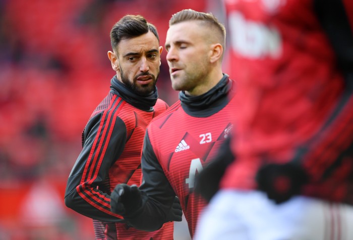 MANCHESTER, ENGLAND - MARCH 08: Bruno Fernandes of Manchester United warms up with Luke Shaw of Manchester United ahead of the Premier League match between Manchester United and Manchester City at Old Trafford on March 08, 2020 in Manchester, United Kingdom. (Photo by Laurence Griffiths/Getty Images)