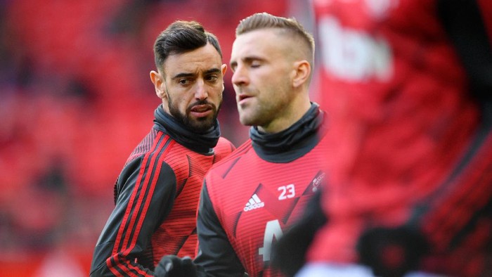 MANCHESTER, ENGLAND - MARCH 08: Bruno Fernandes of Manchester United warms up with Luke Shaw of Manchester United ahead of the Premier League match between Manchester United and Manchester City at Old Trafford on March 08, 2020 in Manchester, United Kingdom. (Photo by Laurence Griffiths/Getty Images)
