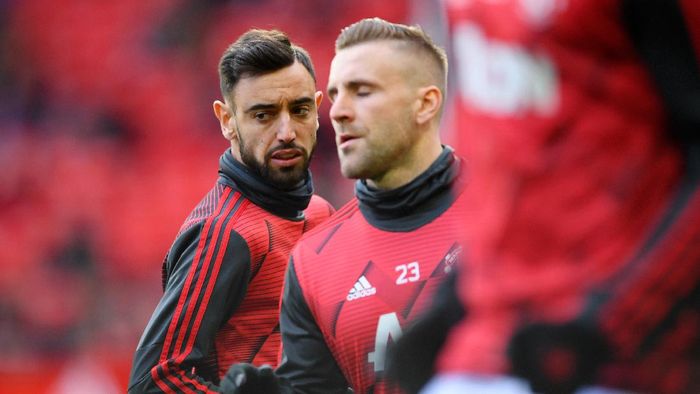 MANCHESTER, ENGLAND - MARCH 08: Bruno Fernandes of Manchester United warms up with Luke Shaw of Manchester United ahead of the Premier League match between Manchester United and Manchester City at Old Trafford on March 08, 2020 in Manchester, United Kingdom. (Photo by Laurence Griffiths/Getty Images)