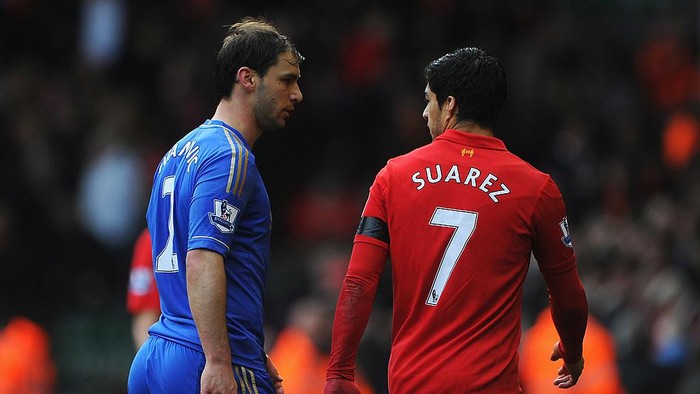 LIVERPOOL, ENGLAND - APRIL 21:  Branislav Ivanovic of Chelsea talks with Luis Suarez of Liverpool as they walk in for half time during the Barclays Premier League match between Liverpool and Chelsea at Anfield on April 21, 2013 in Liverpool, England.  (Photo by Michael Regan/Getty Images)