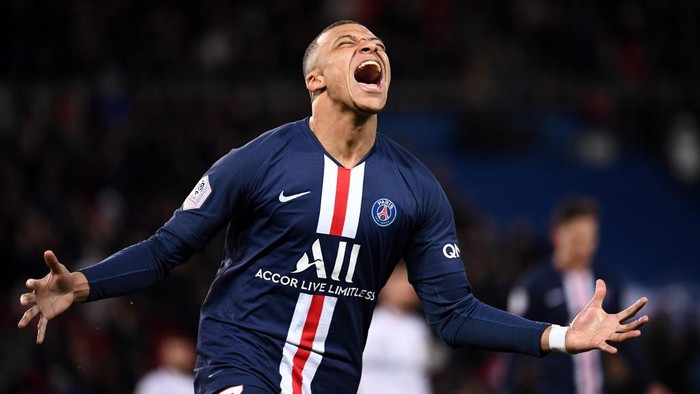 Paris Saint-Germains French forward Kylian Mbappe celebrates after scoring a goal during the French L1 football match between Paris Saint-Germain (PSG) and Dijon, on February 29, 2020 at the Parc des Princes stadium in Paris. (Photo by FRANCK FIFE / AFP)