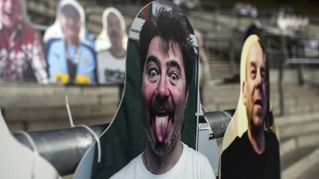 Cardboard cut-outs with portraits of Borussia Moenchegladbach's supporters are seen at the Borussia Park football stadium in Moenchengladbach, western Germany, on April 16, 2020, amid the novel coronavirus COVID-19 pandemic. - Large-scale public events such as football matches will remain banned in Germany until August 31 due to the coronavirus crisis, Berlin said on Wednesday, April 15, 2020, though it did not rule out allowing Bundesliga games to continue behind closed doors. (Photo by Ina FASSBENDER / AFP)