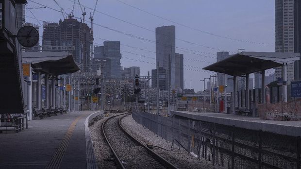 In this Monday, April 6, 2020 photo, a railway station is deserted after authorities shut down railway service in effort to contain the spread of the coronavirus, in Tel Aviv, Israel. The once thrumming city of Tel Aviv, famed for its nightlife and bustling beachfront, has fallen eerily quiet due to Israel's tight movement restrictions to halt the spread of the coronavirus. (AP Photo/Oded Balilty)